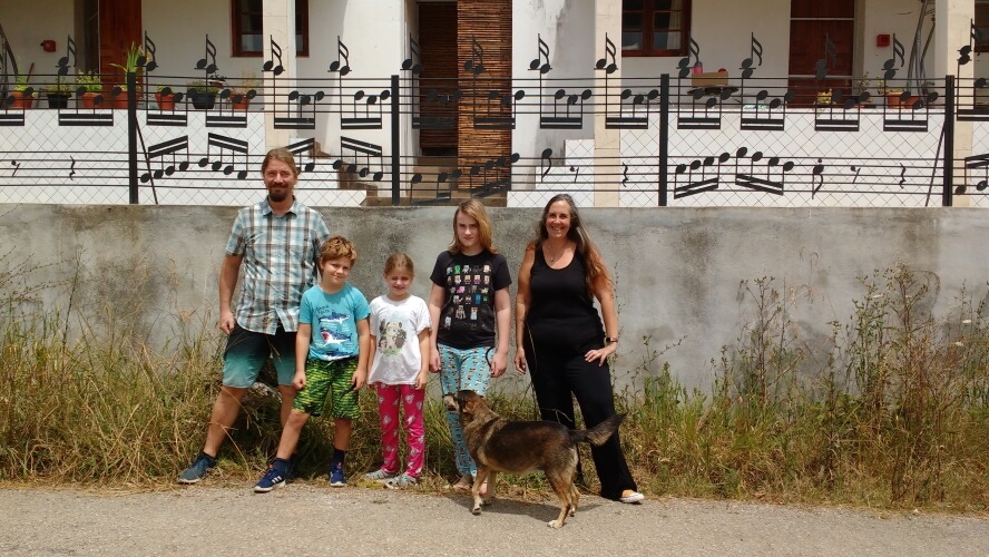 the family in front of the house